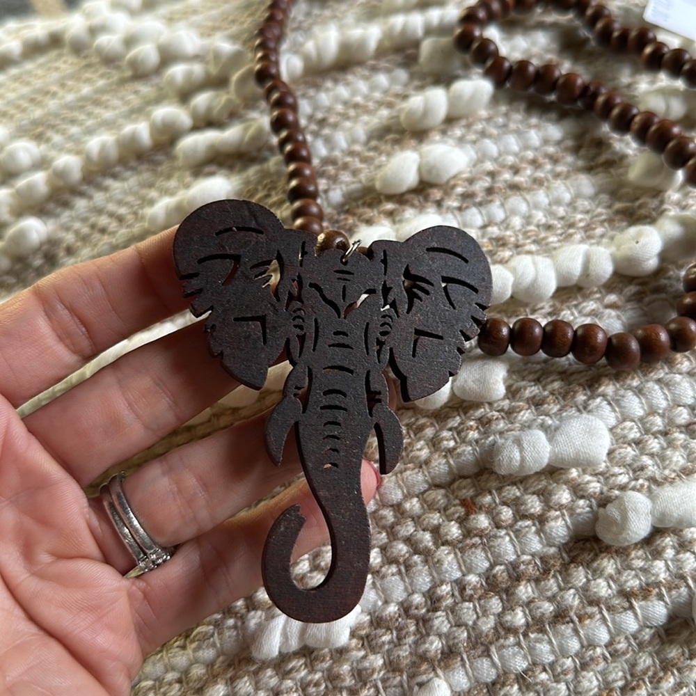 New with tags wooden beaded necklace with large wooden elephant.
